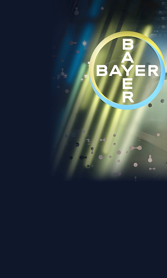 Bayer-Logo vor buntem Hintergrund.